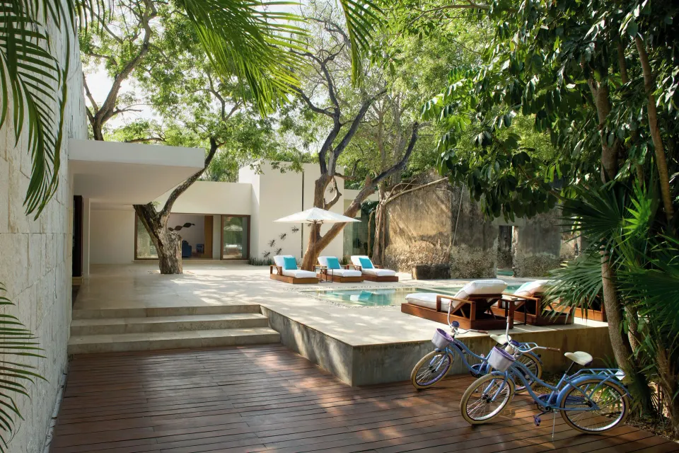 Private villa courtyard with plunge pool and sun loungers at Chablé Yucatán