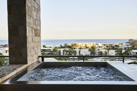 Balcony plunge pool with ocean and resort views at Chileno Bay Resort & Residences.