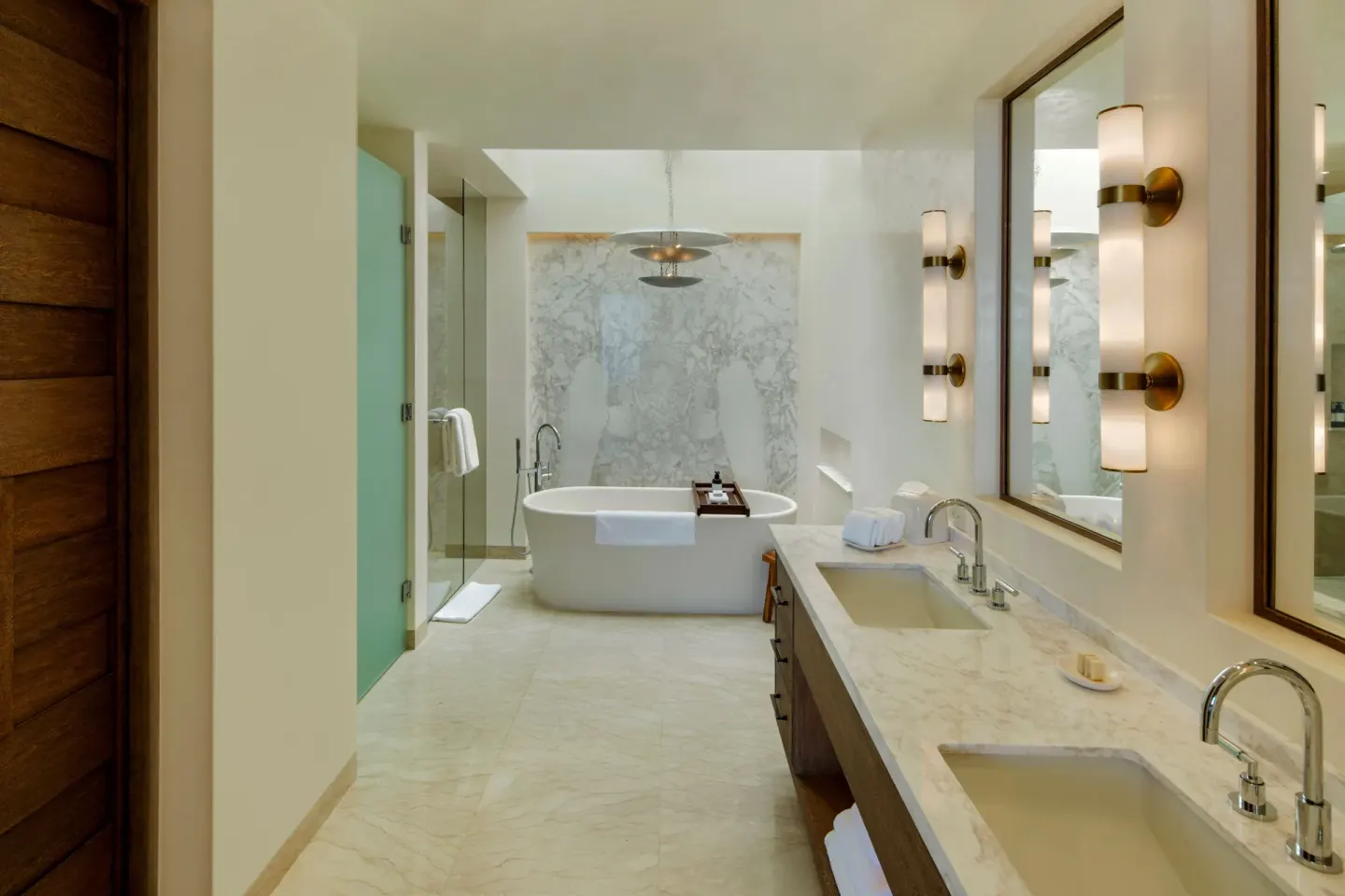 Bathroom with double vanity and freestanding tub at Chileno Bay Resort & Residences.