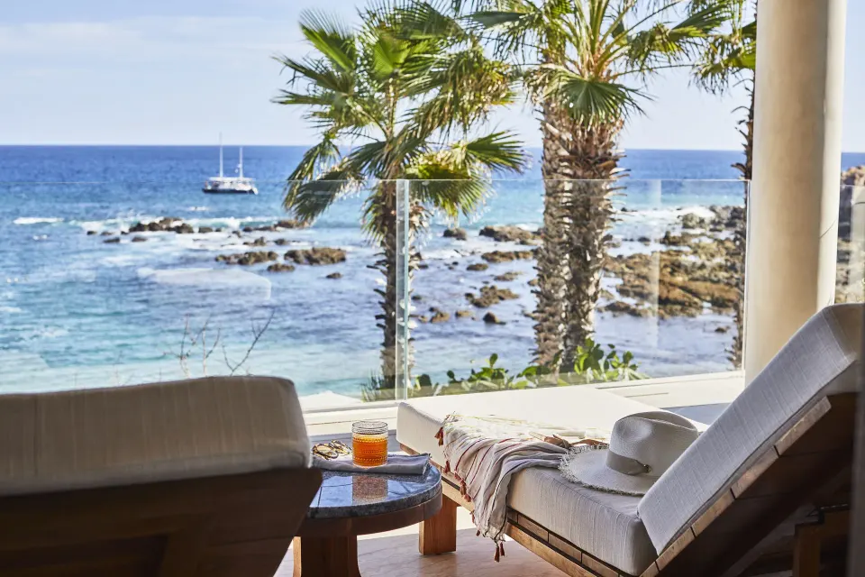 Ocean-view terrace loungers at Chileno Bay Resort & Residences.