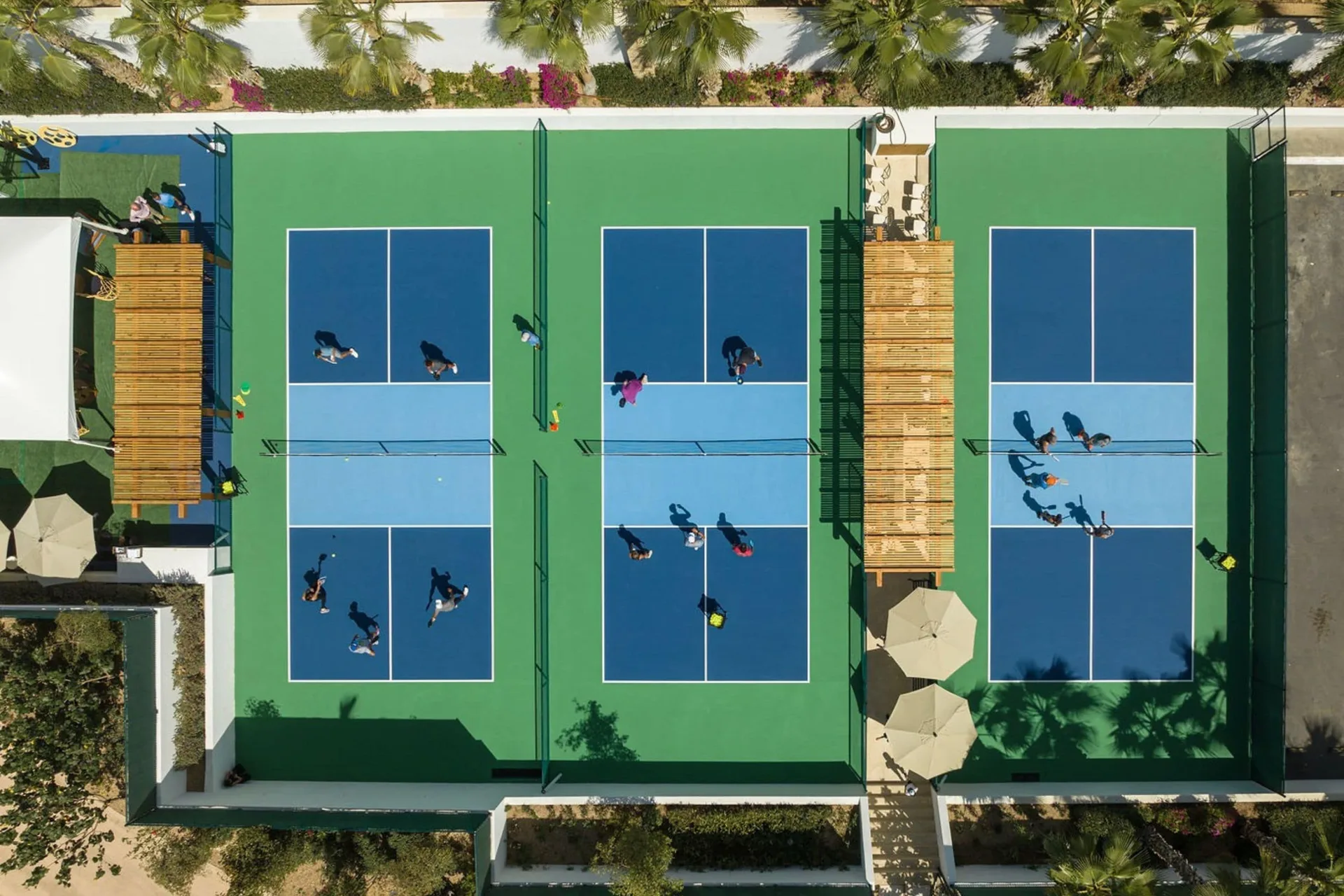 Aerial view of pickleball courts in use at Chileno Bay Resort & Residences.