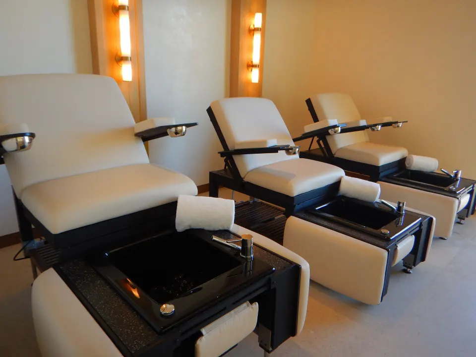 Pedicure chairs with foot basins in the spa at Chileno Bay Resort & Residences.