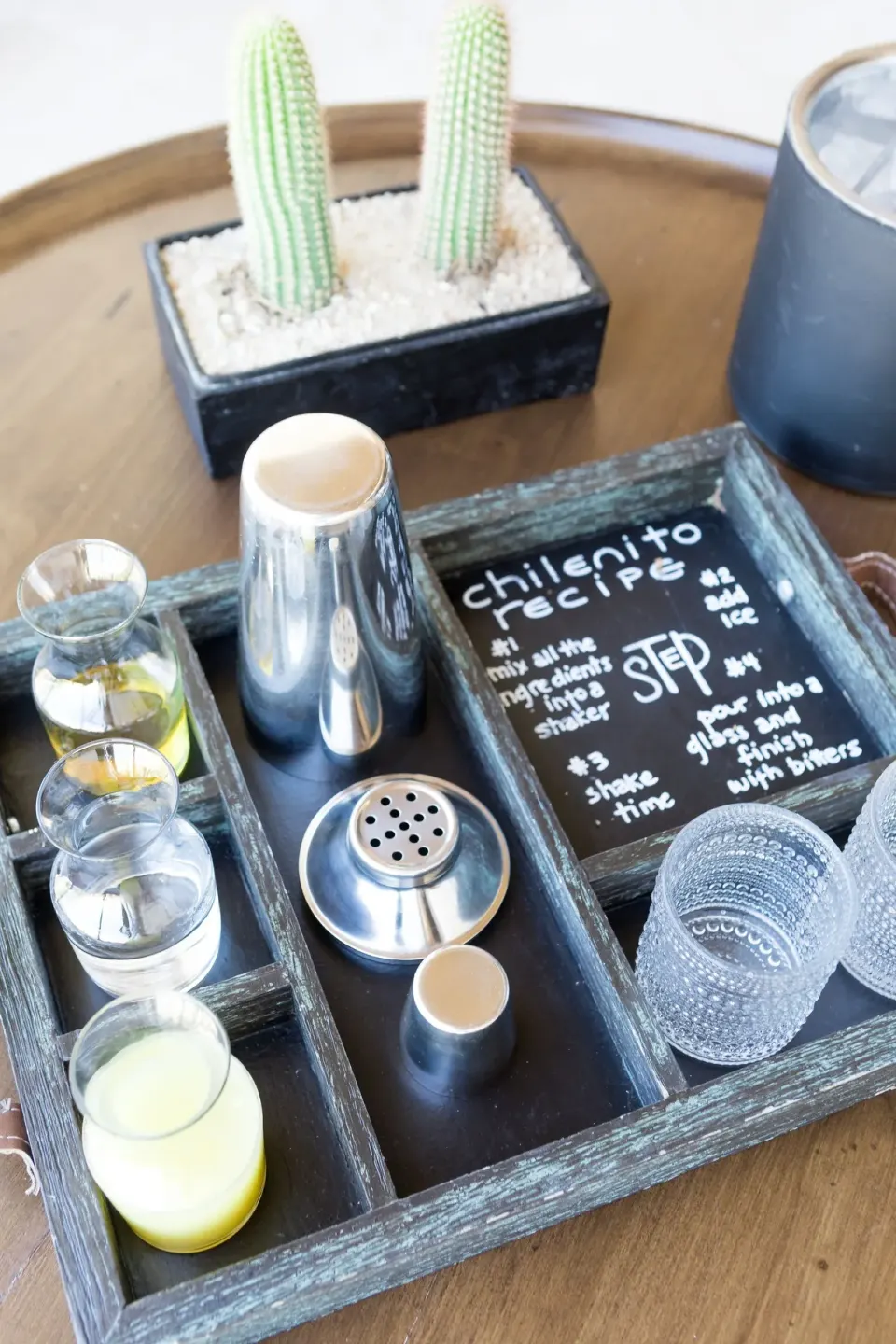 In-room cocktail tray with recipe card at Chileno Bay Resort & Residences.