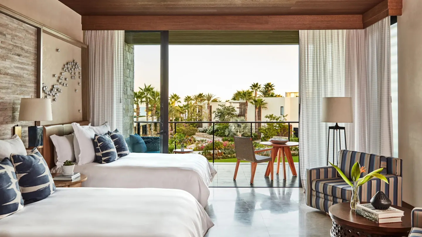 Garden View room with two beds and terrace at Chileno Bay Resort & Residences.