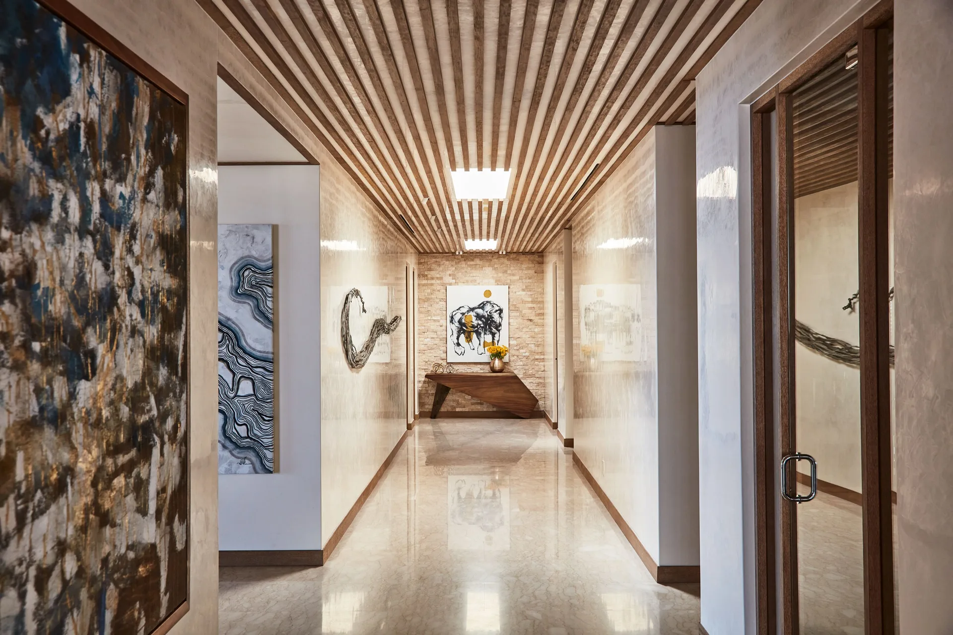 Art-lined hallway in the Signature Villa at Chileno Bay Resort & Residences.