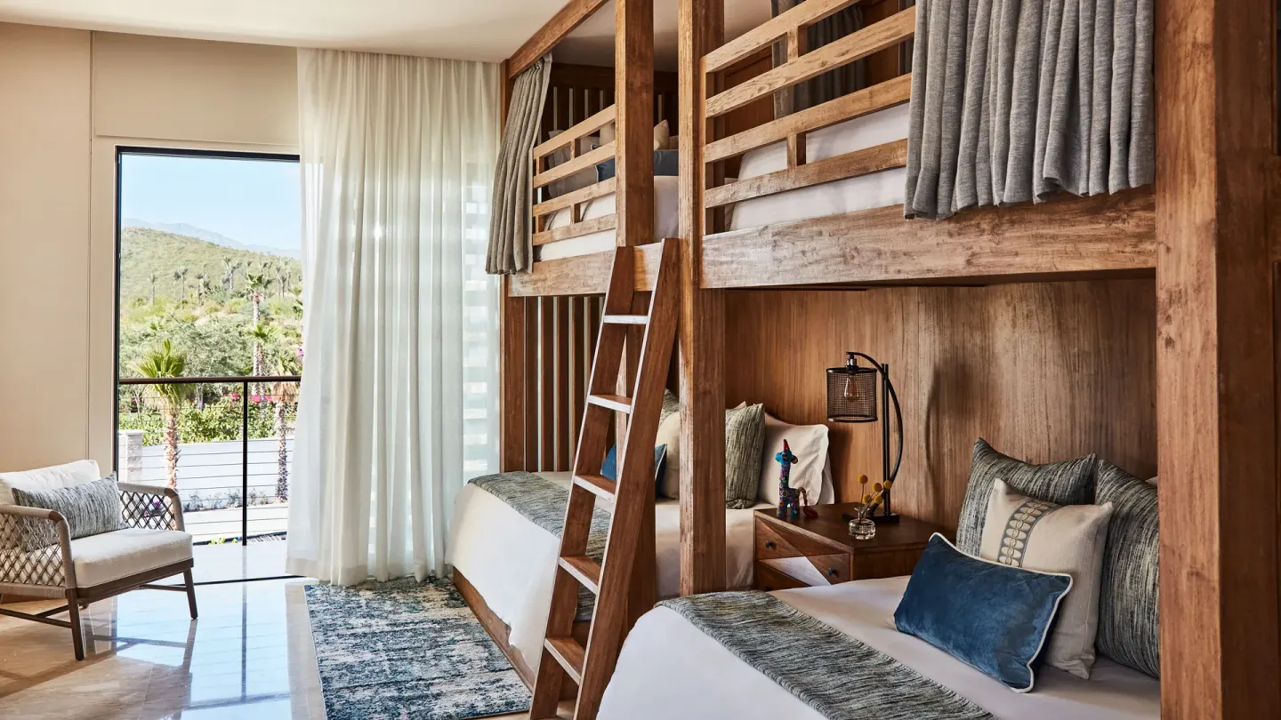 Bunk room with balcony in the Signature Villa at Chileno Bay Resort & Residences.