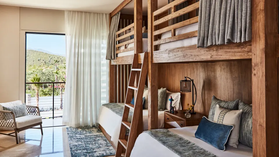 Bunk room with balcony in the Signature Villa at Chileno Bay Resort & Residences.