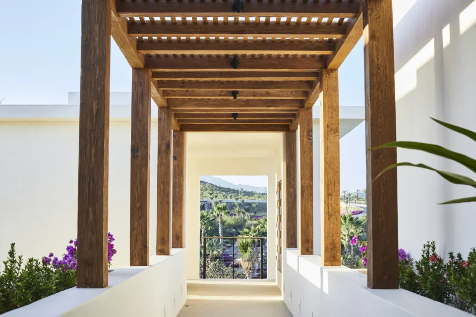 Wood pergola walkway in the Signature Villa at Chileno Bay Resort & Residences.
