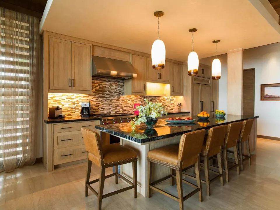 Villa kitchen with island seating at Chileno Bay Resort & Residences.