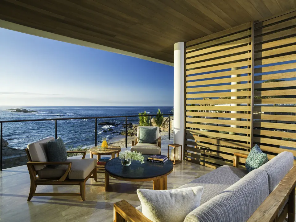 Covered oceanfront terrace seating at Chileno Bay Resort & Residences.