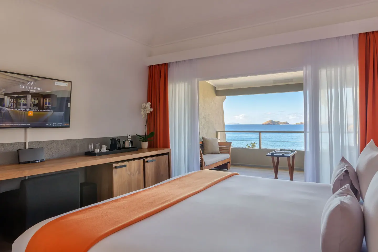 King bed guest room with balcony and ocean view at Christopher Hotel.
