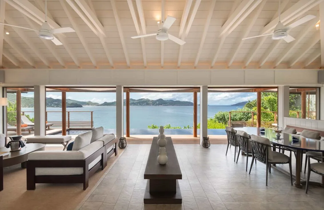 Open-plan villa living and dining room with ocean views at Christopher Hotel.