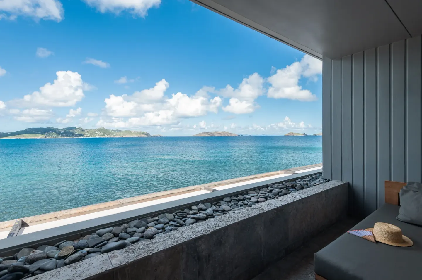 Private terrace daybed facing the ocean and islands at Christopher Hotel.