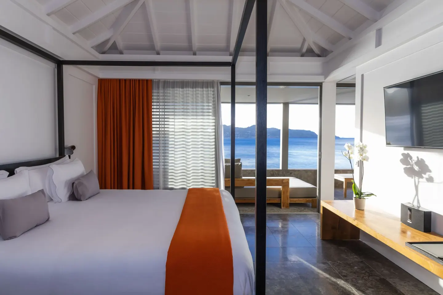 Panoramic Suite bedroom with ocean-facing terrace at Christopher Hotel.