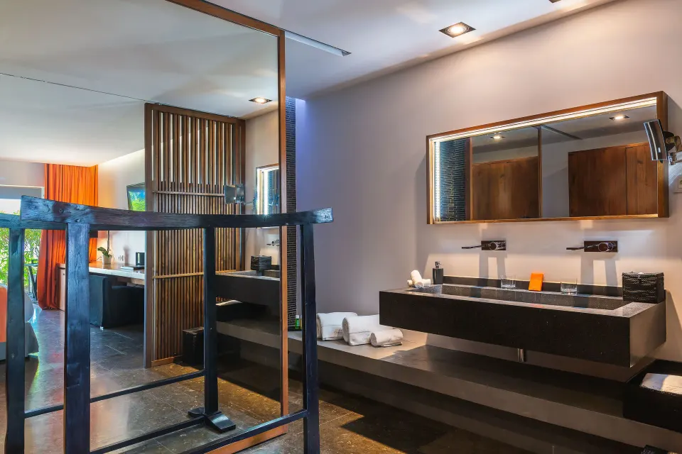 Terrace ocean room bathroom with double vanity and mirrors at Christopher Hotel.
