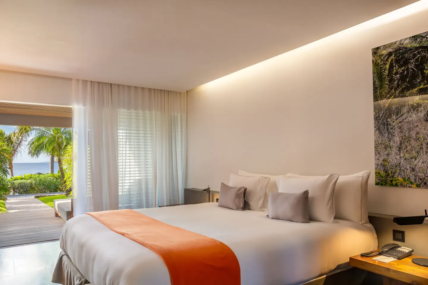 Terrace ocean room with king bed and garden-facing terrace at Christopher Hotel.