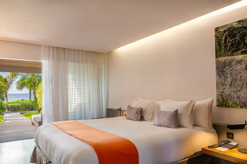 Terrace ocean room with king bed and garden-facing terrace at Christopher Hotel.