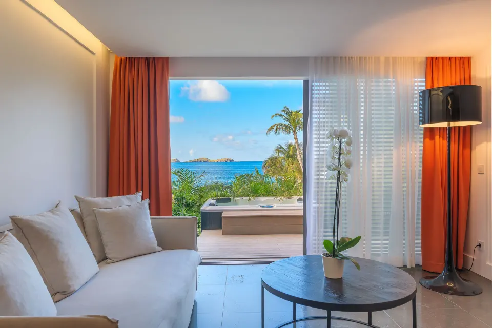Ocean Spa Suite sitting room with terrace spa tub and sea view at Christopher Hotel.