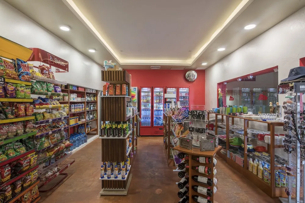 Resort market shelves stocked with snacks and drinks at Club Regina Cancun.