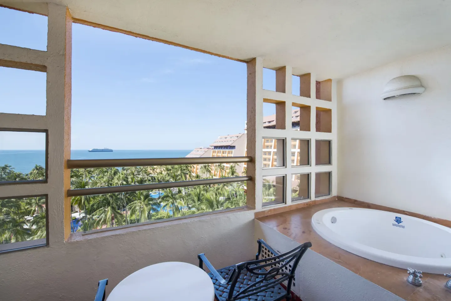 Balcony with soaking tub and ocean view at Club Regina Puerto Vallarta.