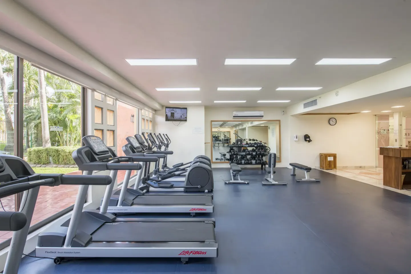 Fitness center with treadmills and weights at Club Regina Puerto Vallarta.