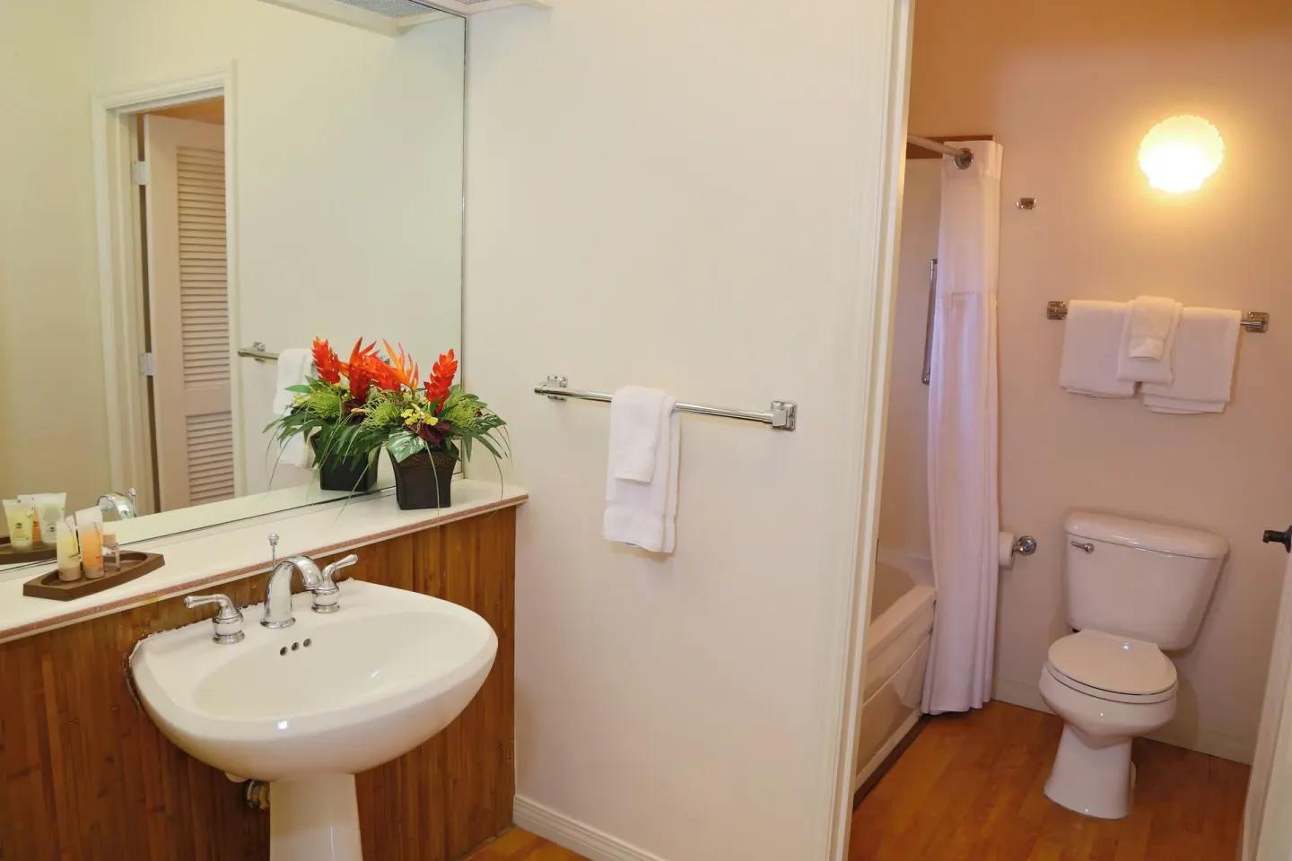 Bathroom sink with separate toilet and tub area at Club Wyndham Bali Hai Villas.