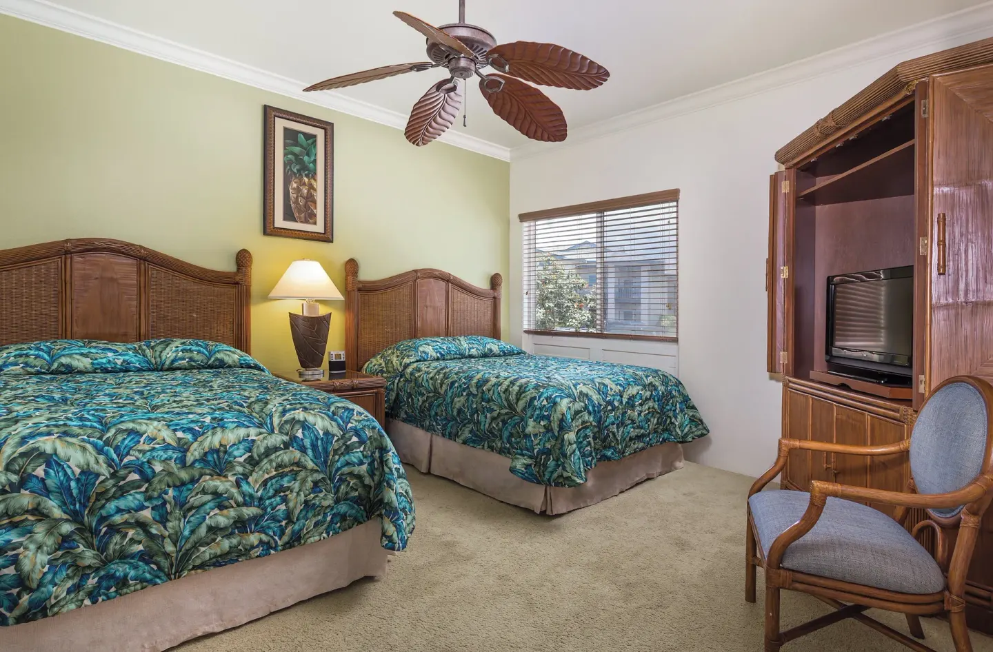 Bedroom with two beds and wicker furnishings at Club Wyndham Bali Hai Villas.