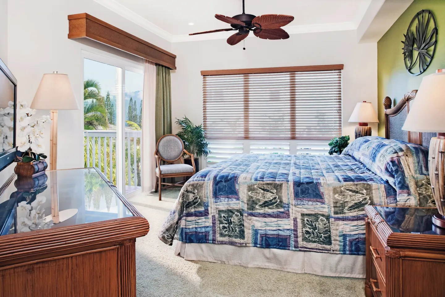 Bright bedroom with a king bed and balcony door at Club Wyndham Bali Hai Villas.