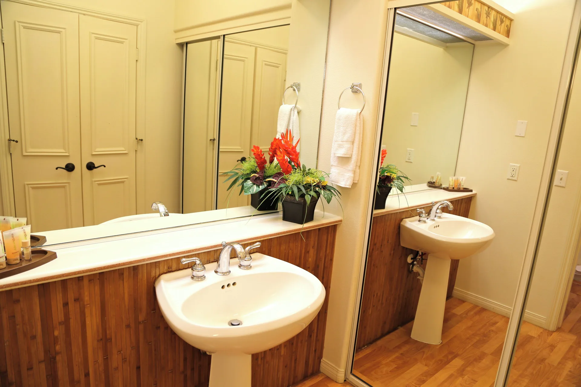 Pedestal sink and mirrored closet in a villa bathroom at Club Wyndham Bali Hai Villas.