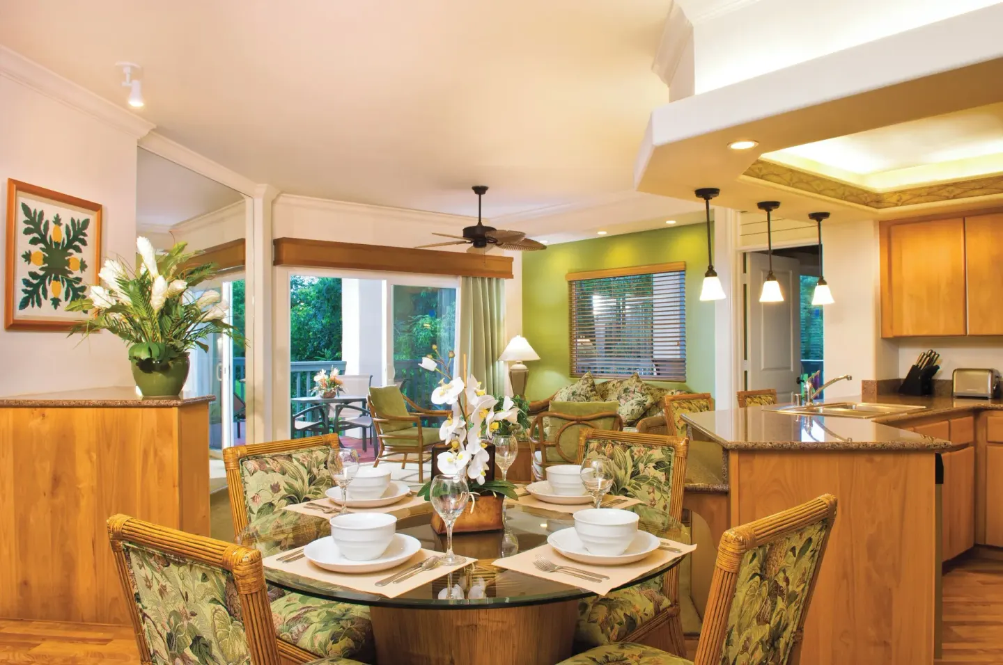 Dining table, kitchen, and sitting area in a villa at Club Wyndham Bali Hai Villas.