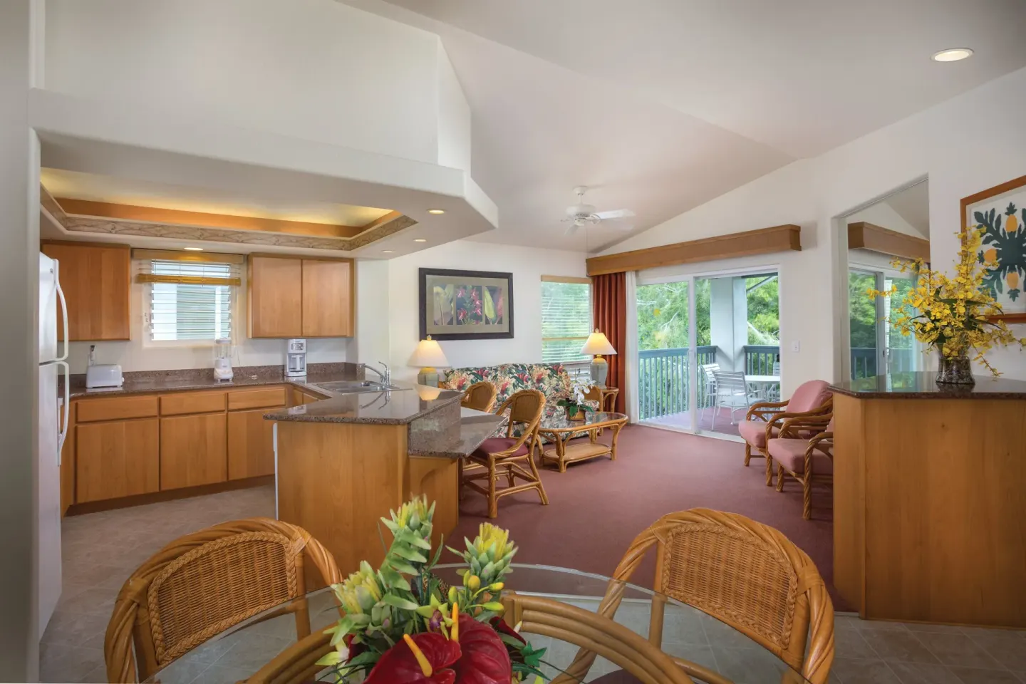 Villa kitchen and living room with balcony access at Club Wyndham Bali Hai Villas.