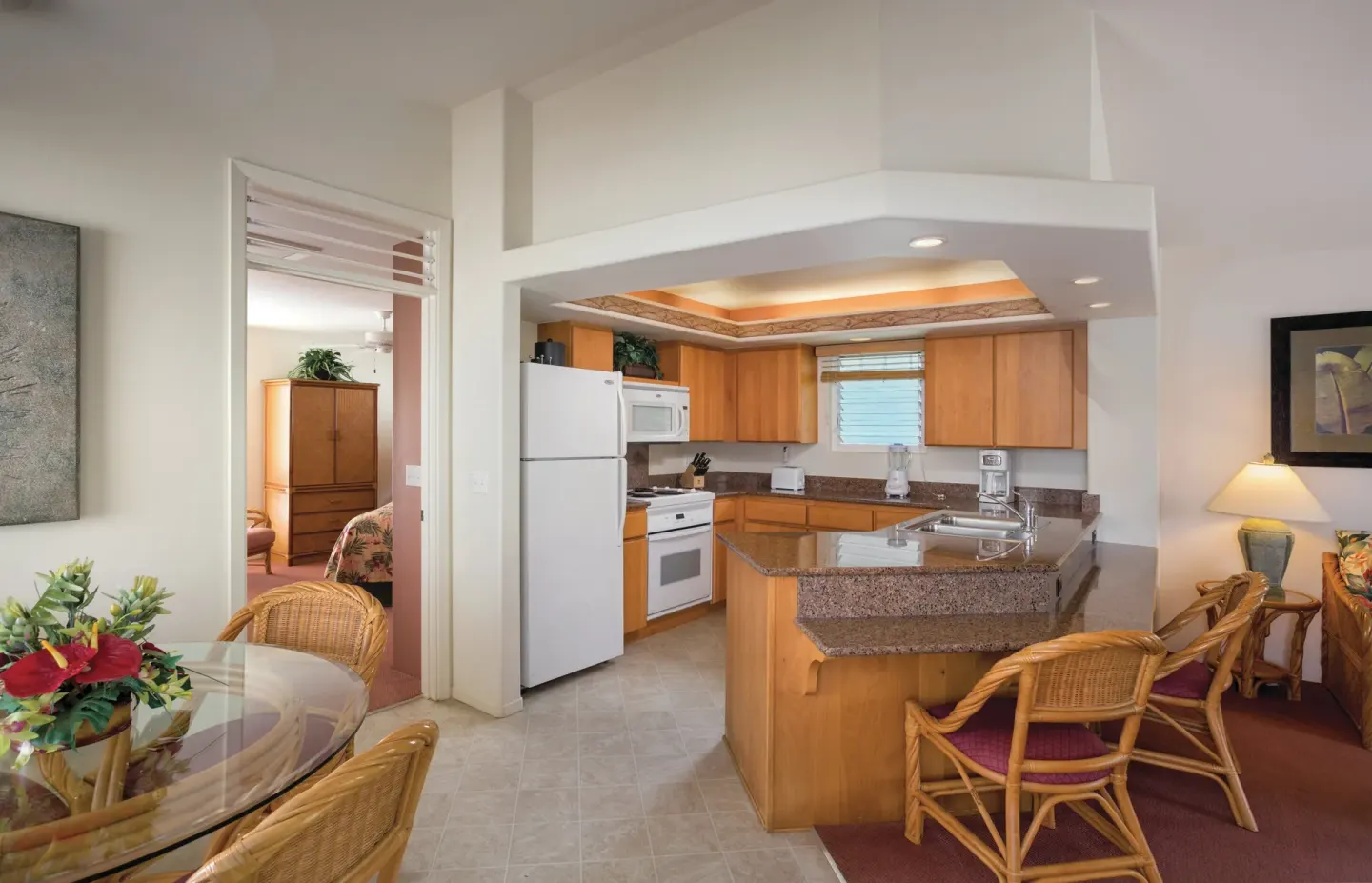 Villa kitchen with granite counter and dining area at Club Wyndham Bali Hai Villas.