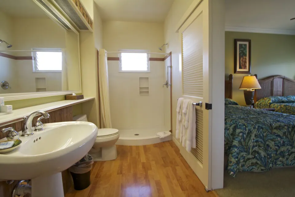 Two-bedroom suite bathroom with walk-in shower and bedroom beyond at Club Wyndham Bali Hai Villas.