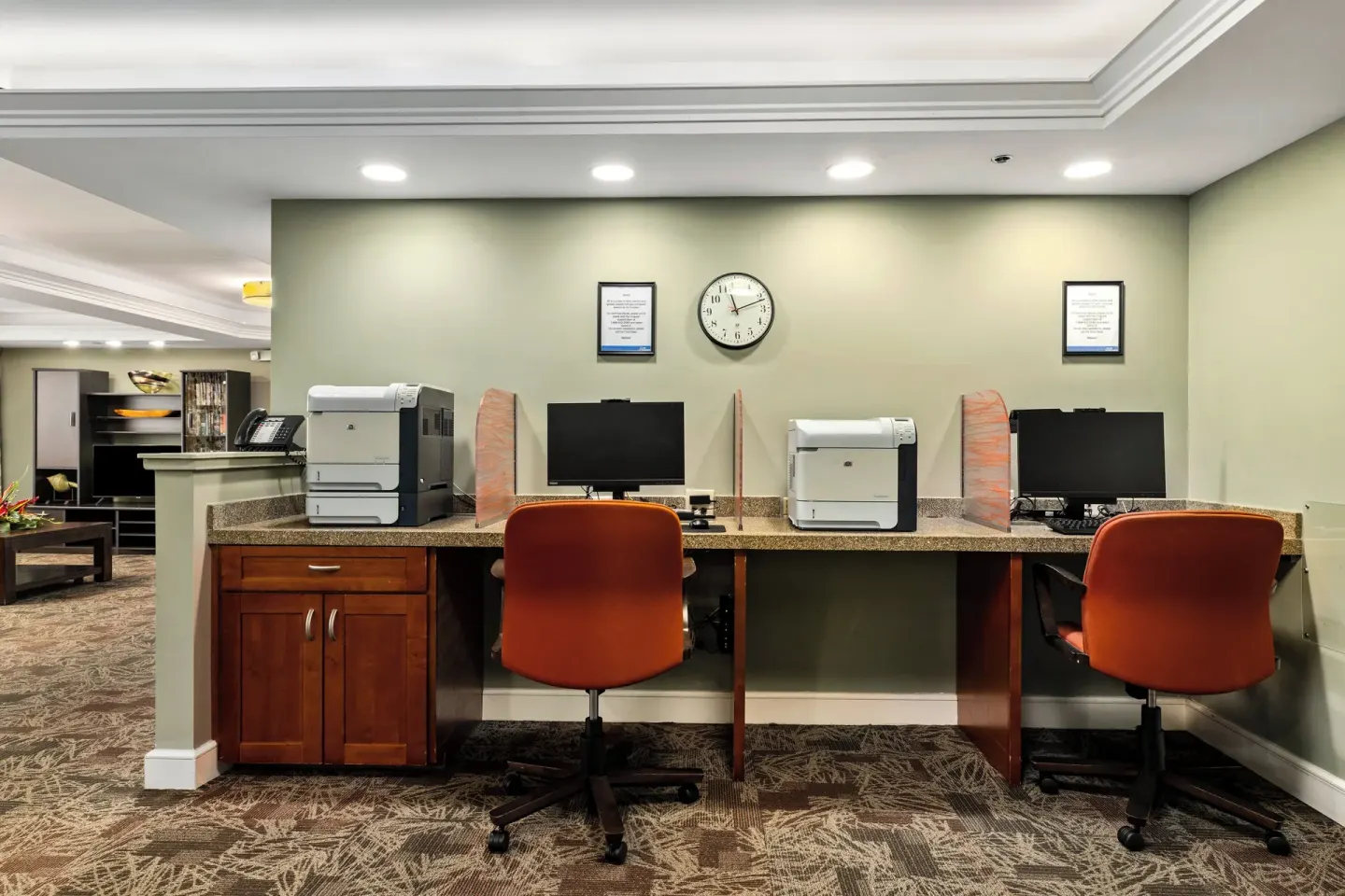 Business center desks with computers and printers at Club Wyndham Royal Garden at Waikiki.