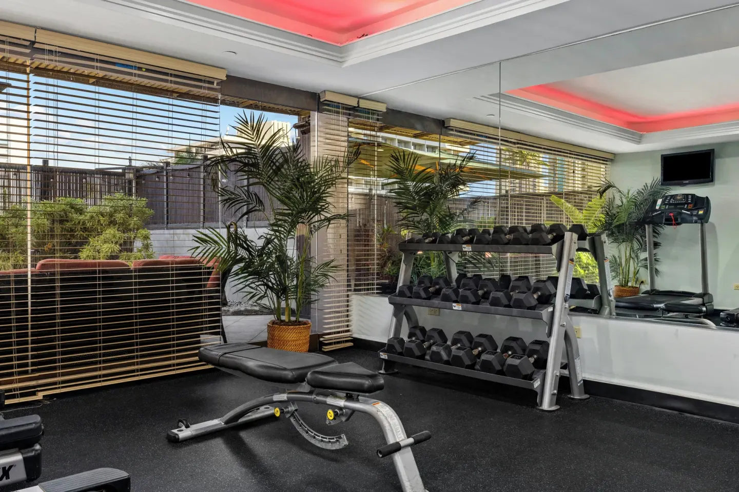 Fitness room with weights and treadmill at Club Wyndham Royal Garden at Waikiki.