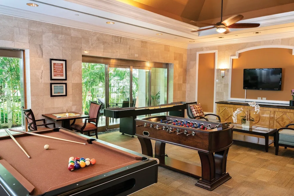 Game room with billiards and foosball at Club Wyndham Royal Garden at Waikiki.