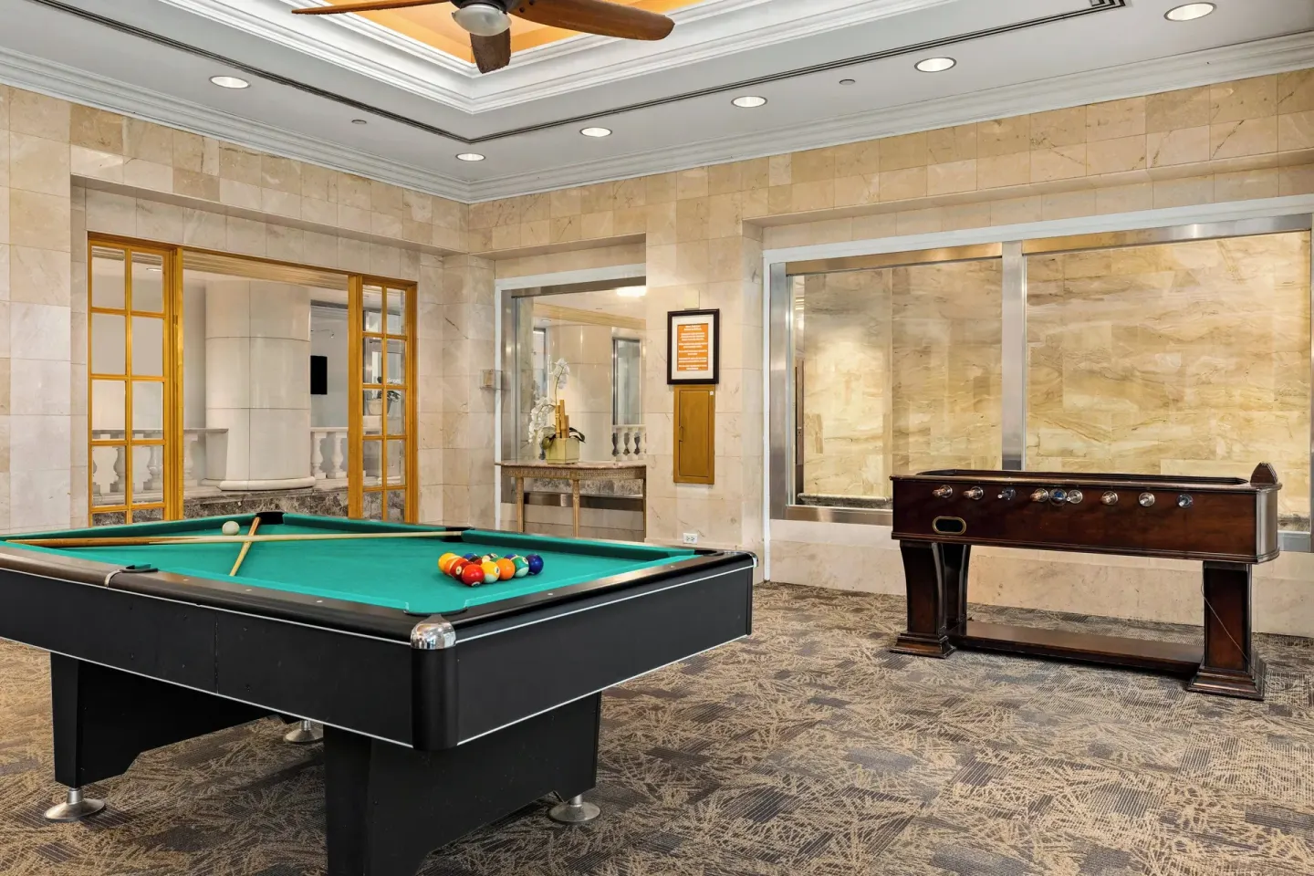 Game room with pool table and foosball at Club Wyndham Royal Garden at Waikiki.