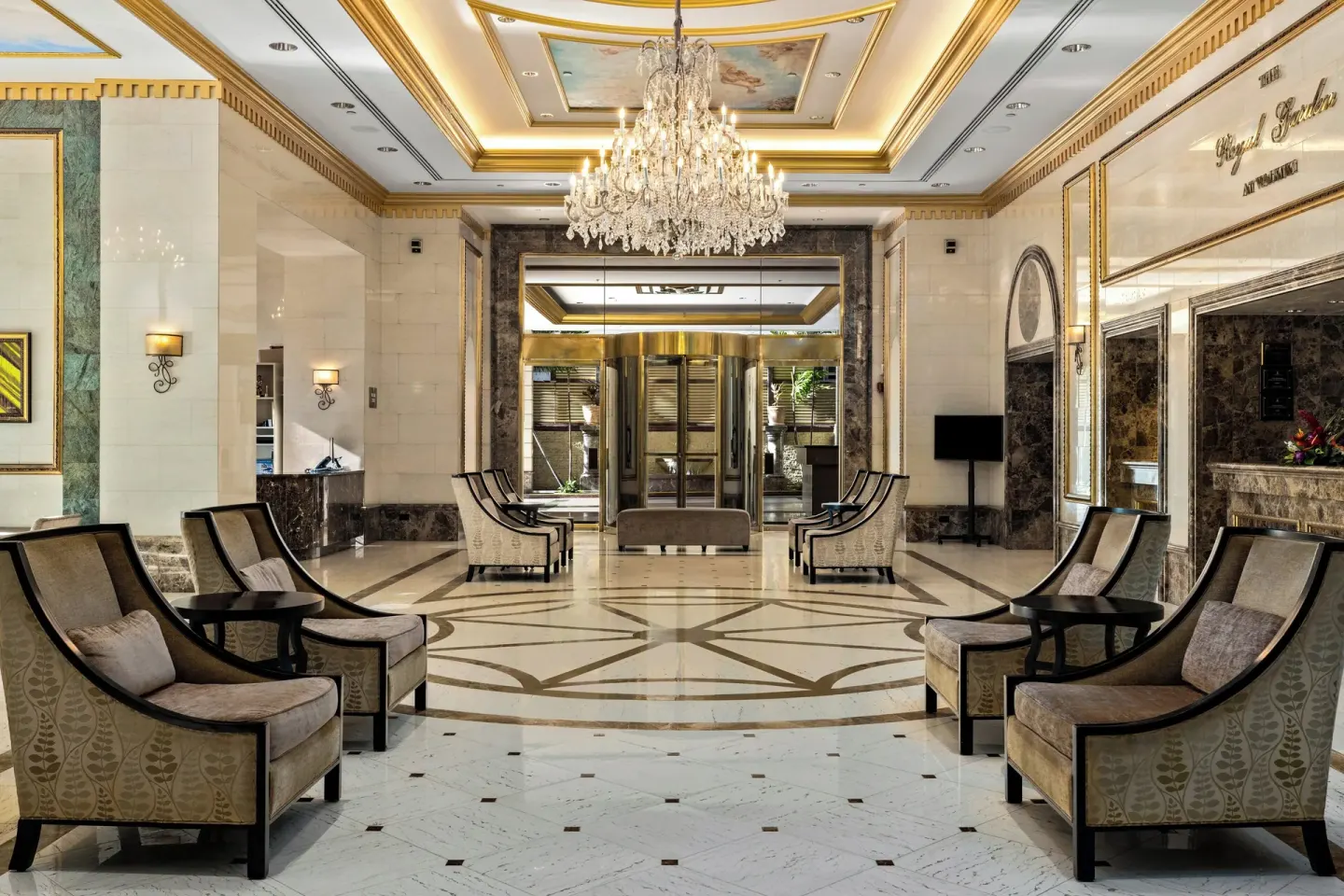 Grand lobby with chandelier and rows of chairs at Club Wyndham Royal Garden at Waikiki.