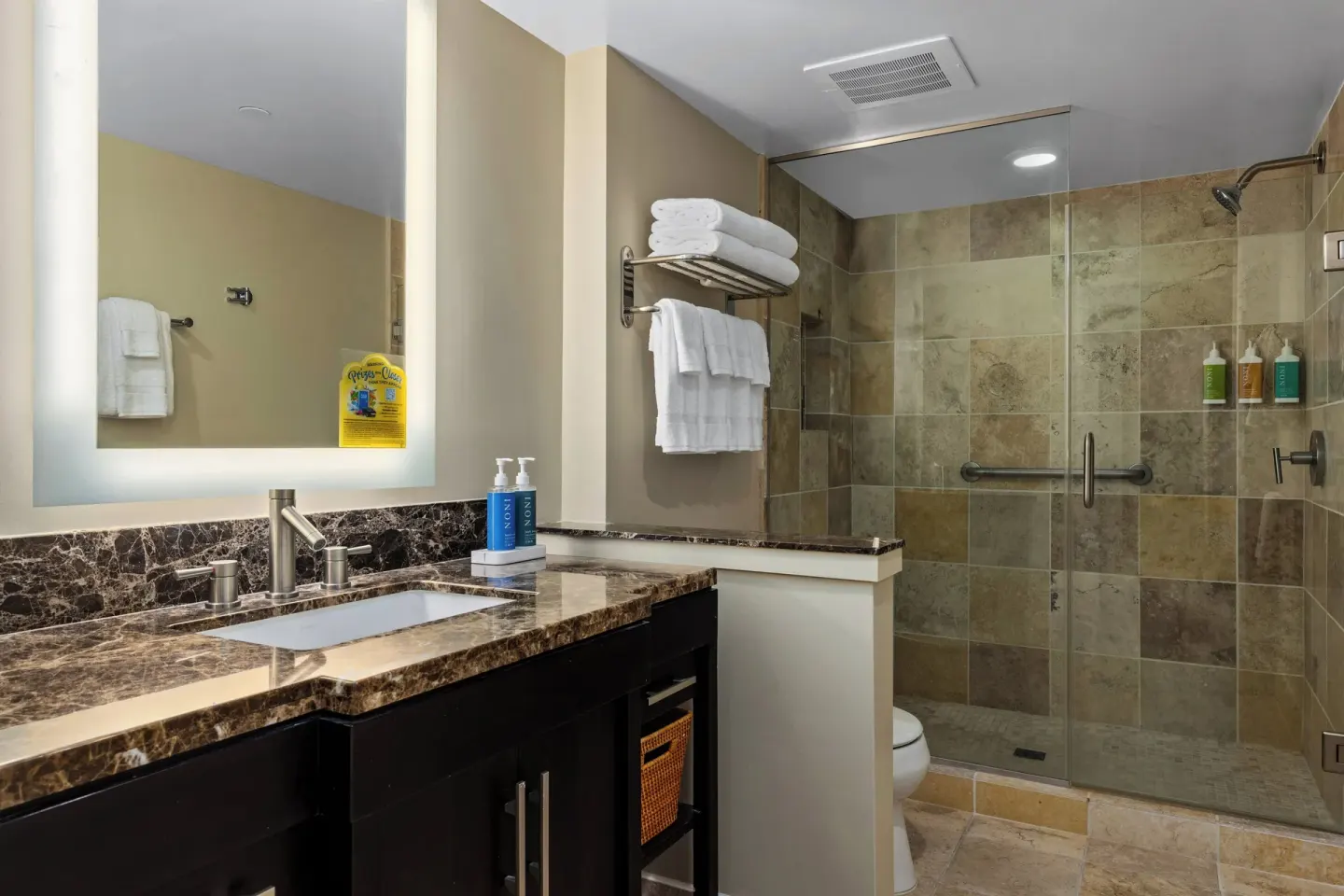 Guest bathroom with glass shower at Club Wyndham Royal Garden at Waikiki.