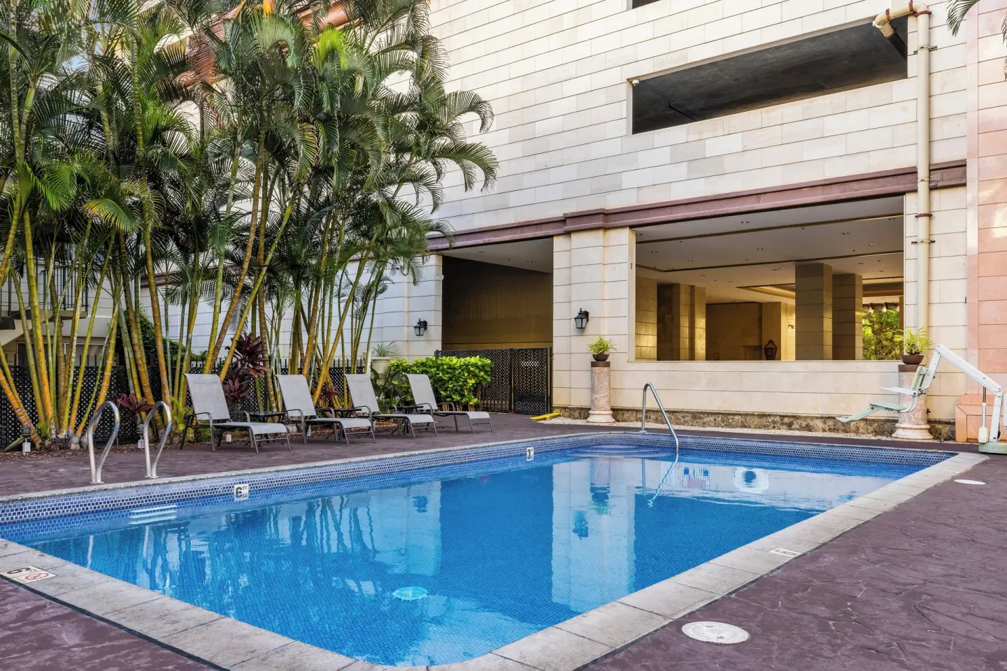 Pool deck and resort building at Club Wyndham Royal Garden at Waikiki.