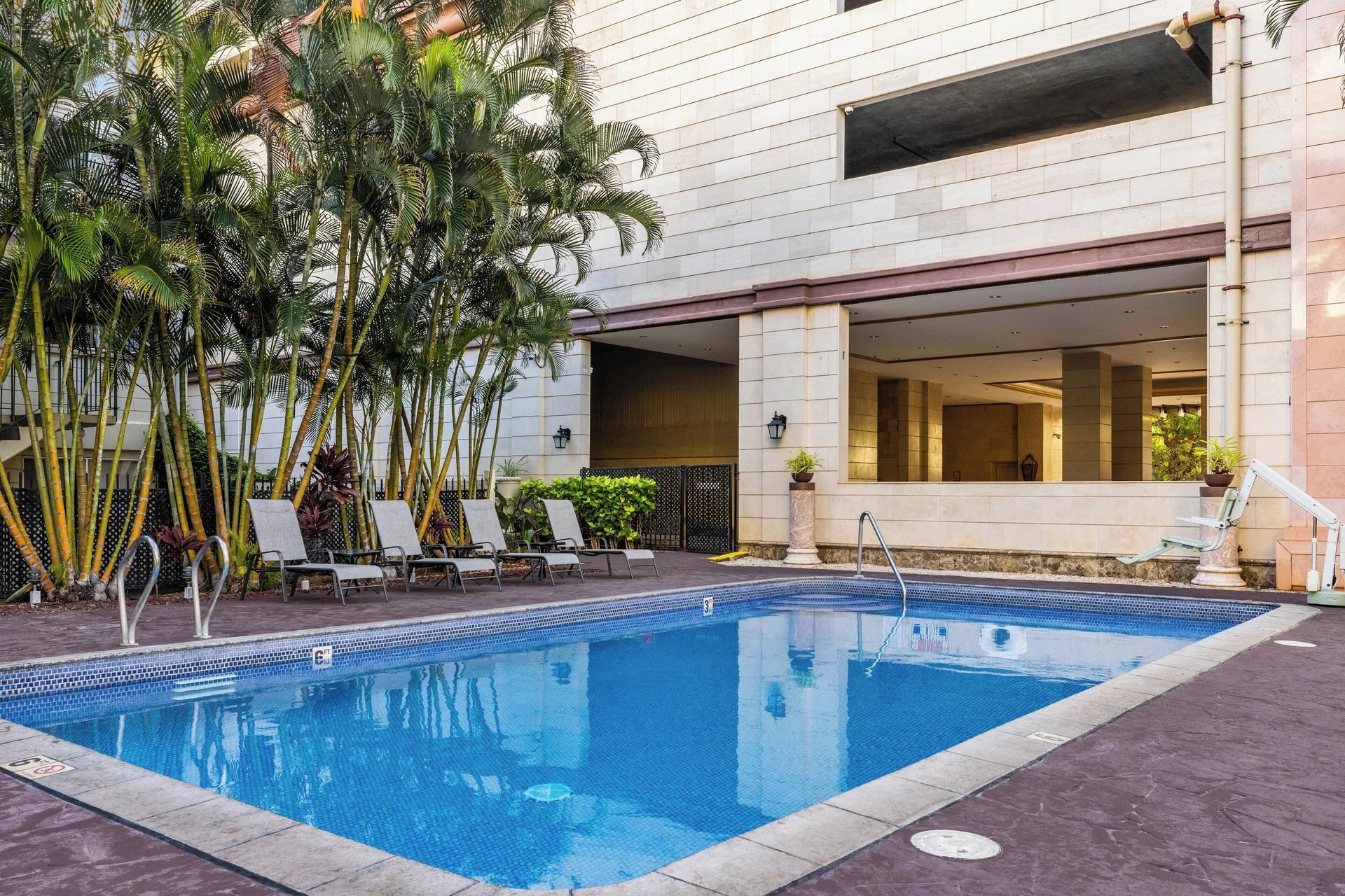 Pool deck and resort building at Club Wyndham Royal Garden at Waikiki.