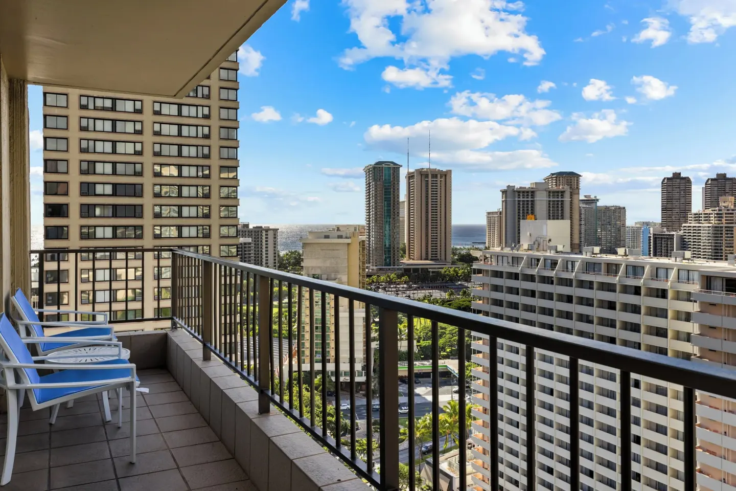 Standard Studio balcony with chairs and Waikiki high-rise views at Club Wyndham Royal Garden at Waikiki.