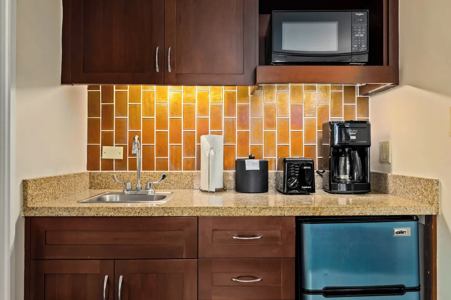 Standard Studio kitchenette with sink, microwave, coffee maker, and mini fridge at Club Wyndham Royal Garden at Waikiki.