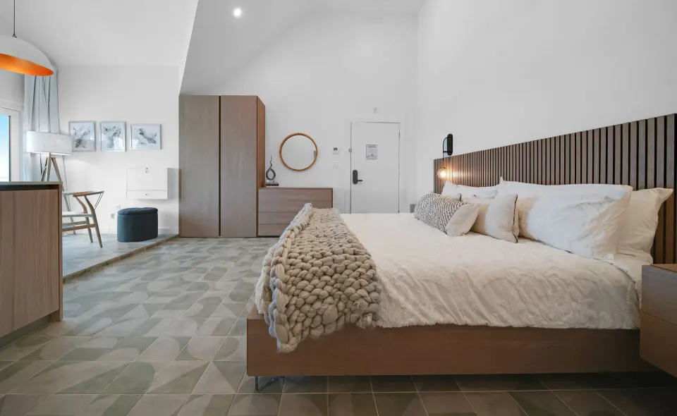 Ocean View room with king bed and wood furnishings at Cobalt Coast Resort.