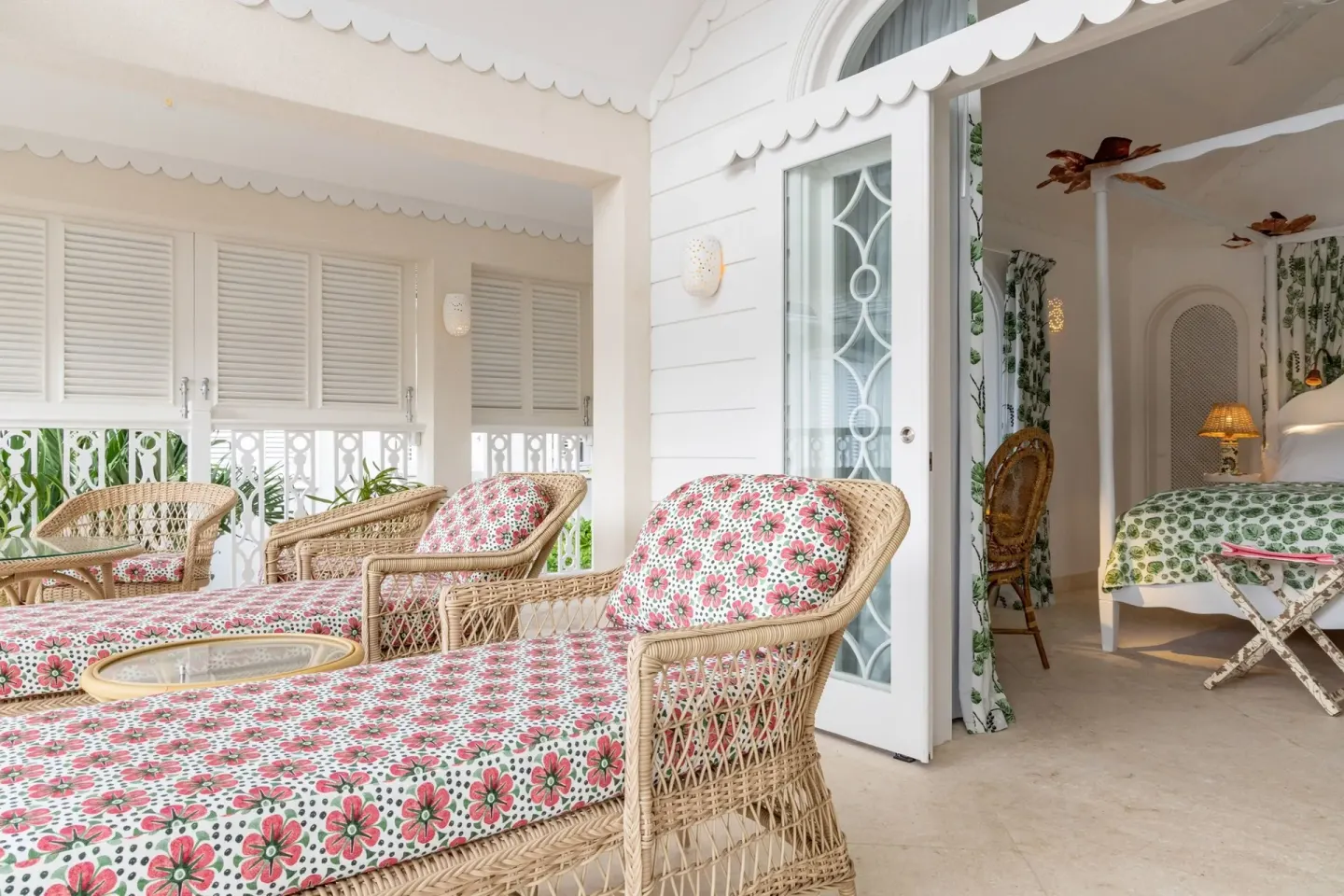 Floral wicker terrace seating outside a guest room at Cobblers Cove.