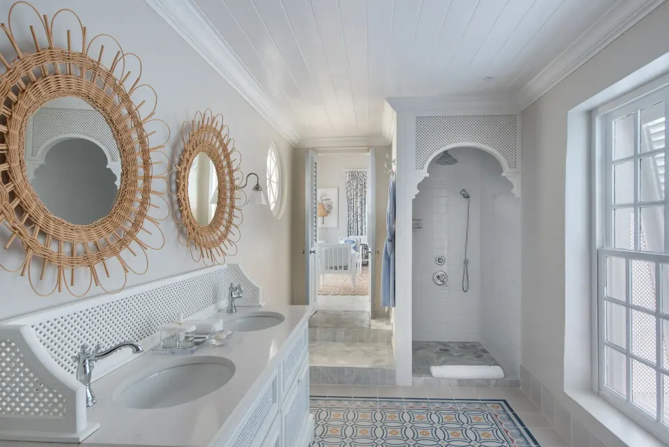 Camelot at the Great House bathroom at Cobblers Cove with double vanity and walk-in shower.