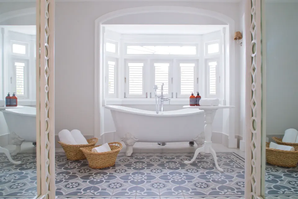 Colleton at the Great House bathroom with clawfoot tub and patterned tile at Cobblers Cove.