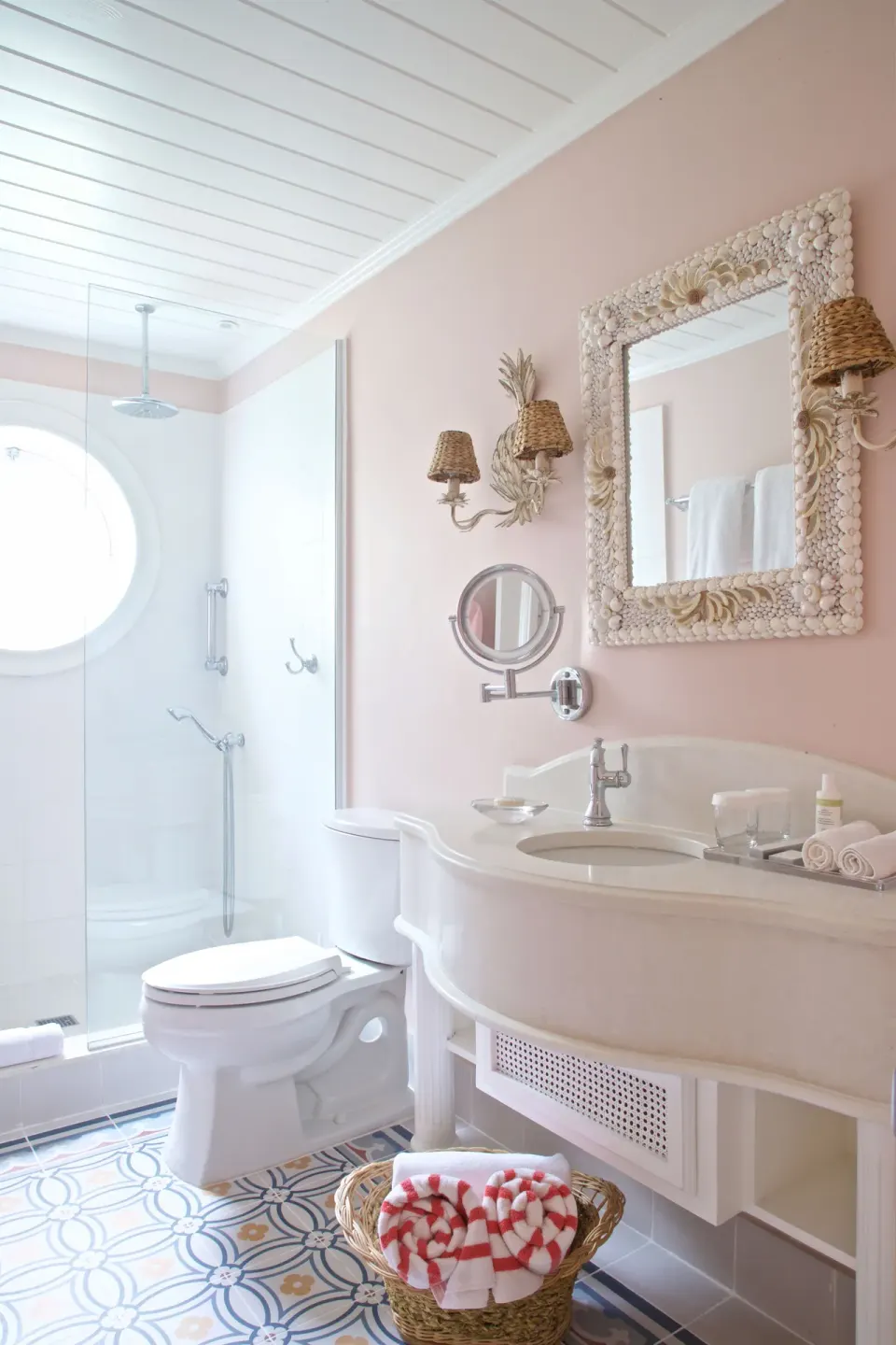 Royal Circle Suite bathroom with shower, vanity and shell-framed mirror at Cobblers Cove.
