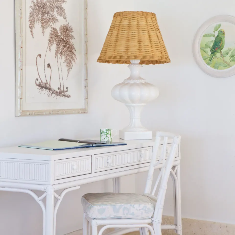 Royal Circle Suite writing desk with wicker chair and lamp at Cobblers Cove.