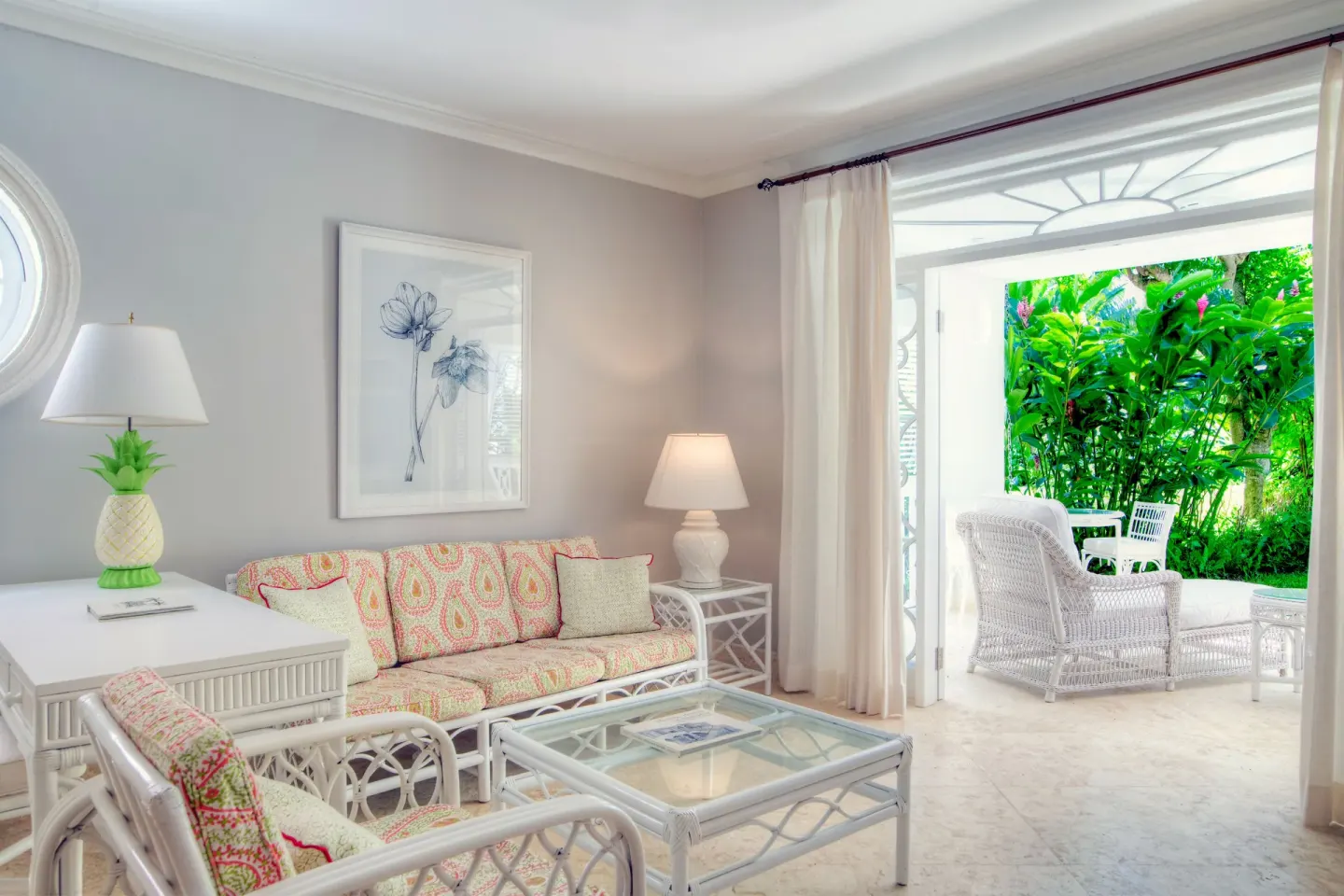 Two Bedroom Suite living room with open terrace and garden greenery at Cobblers Cove.